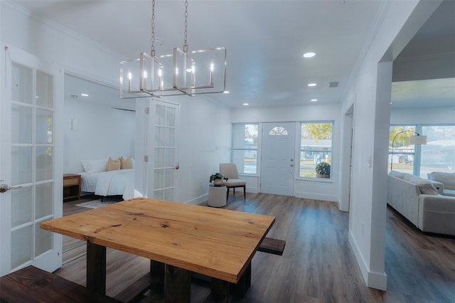 dining space featuring wood finished floors, baseboards, visible vents, recessed lighting, and ornamental molding