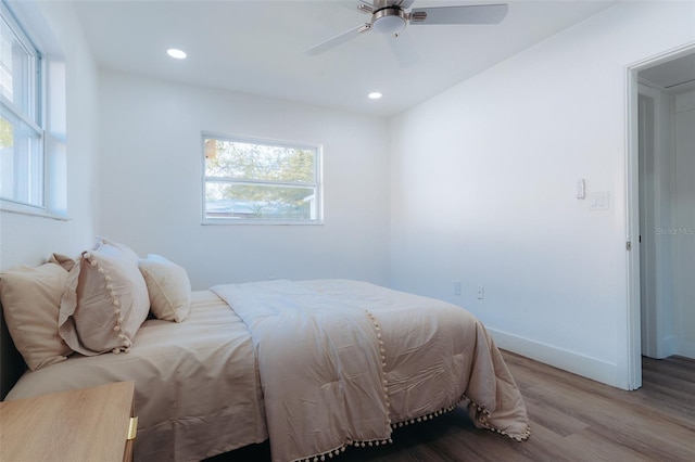 bedroom featuring recessed lighting, baseboards, wood finished floors, and ceiling fan