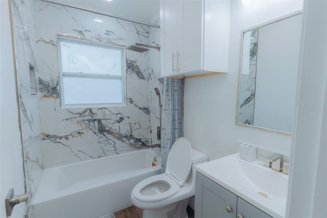 bathroom with vanity, shower / tub combination, and toilet