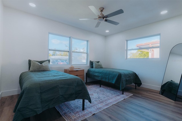 bedroom featuring recessed lighting, ceiling fan, baseboards, and wood finished floors