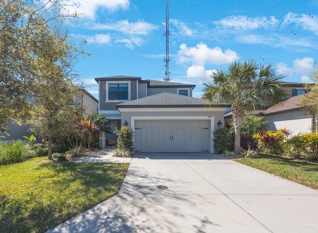 view of front of home with stucco siding, a front lawn, concrete driveway, and an attached garage