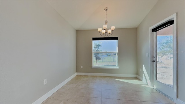 unfurnished dining area with a wealth of natural light, a chandelier, baseboards, and light tile patterned flooring