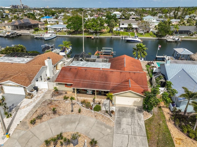 drone / aerial view with a residential view and a water view