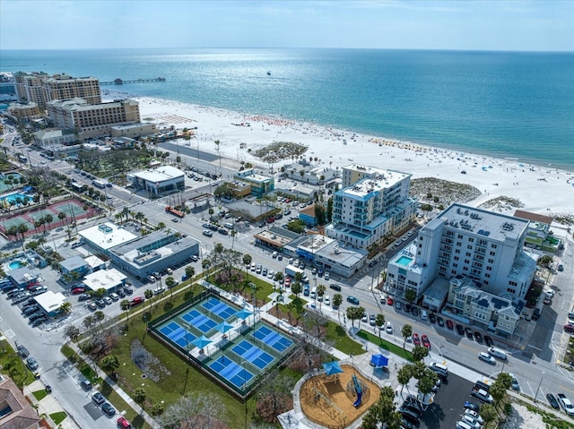 drone / aerial view featuring a view of the beach and a water view