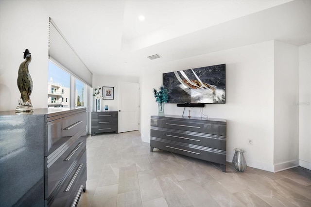 bedroom featuring visible vents and baseboards