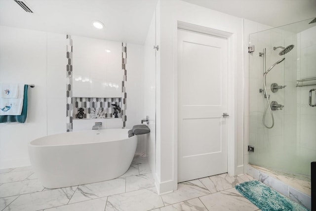 bathroom featuring a soaking tub, visible vents, marble finish floor, and a stall shower