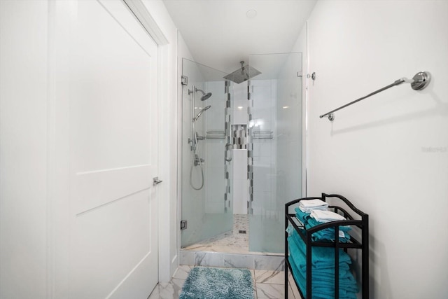 full bath featuring marble finish floor and a stall shower