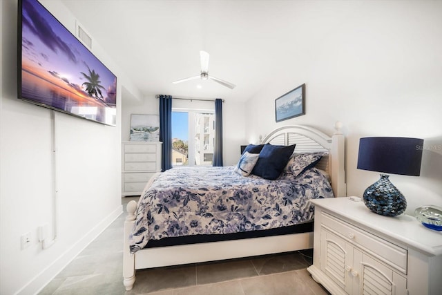 bedroom featuring light tile patterned flooring and baseboards