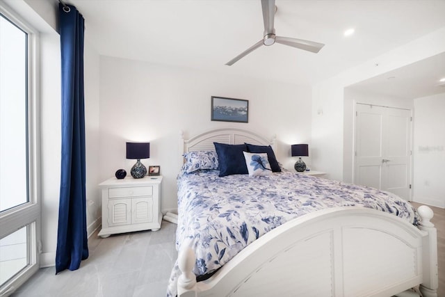 bedroom featuring baseboards and ceiling fan