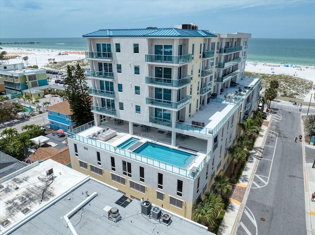 aerial view featuring a water view and a view of the beach