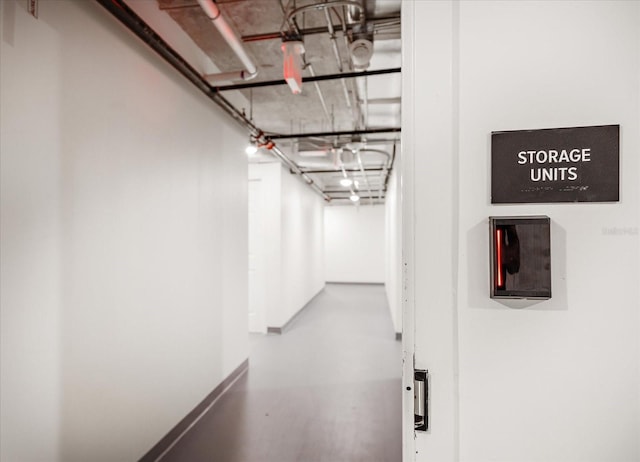 corridor featuring concrete flooring