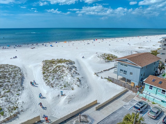 drone / aerial view with a view of the beach and a water view