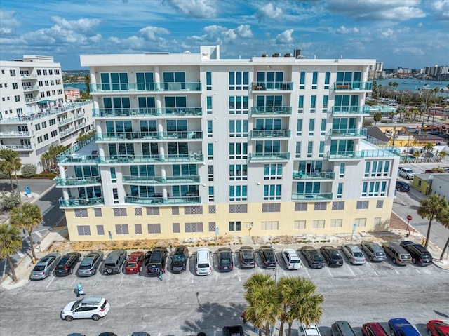 view of building exterior featuring uncovered parking