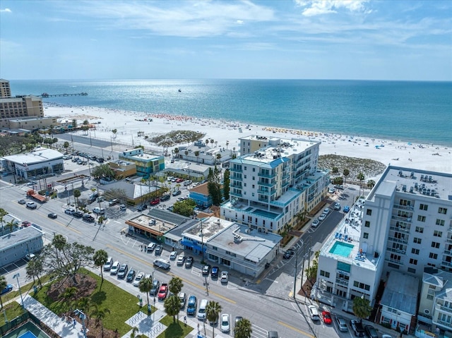 birds eye view of property featuring a view of the beach and a water view