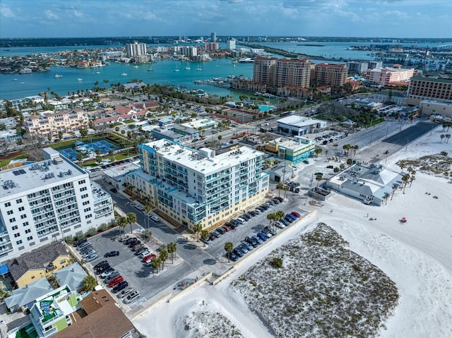 birds eye view of property featuring a view of city and a water view