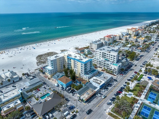 bird's eye view with a city view, a view of the beach, and a water view