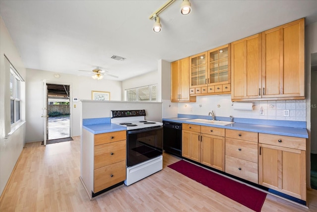 kitchen with visible vents, light wood-type flooring, electric stove, a sink, and black dishwasher