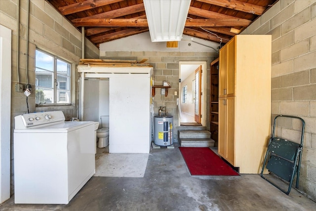 basement with concrete block wall, washer / clothes dryer, and water heater