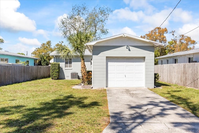 view of front of property featuring cooling unit, a garage, a front yard, and fence