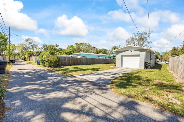 exterior space featuring driveway and fence