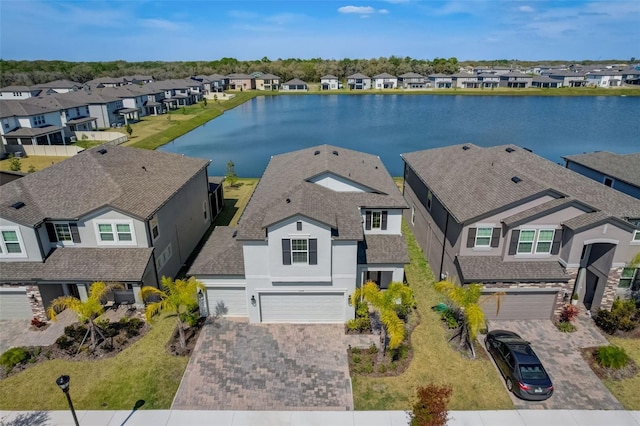 birds eye view of property with a residential view and a water view