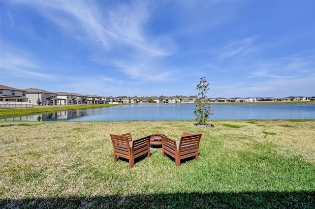water view featuring a fire pit and a residential view