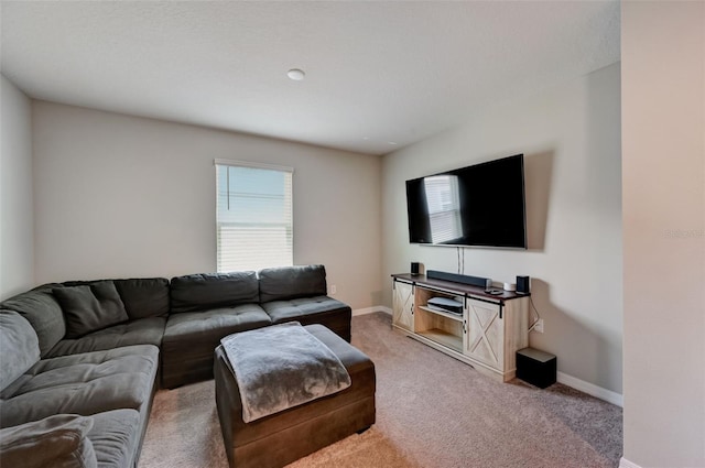 living room with light carpet and baseboards