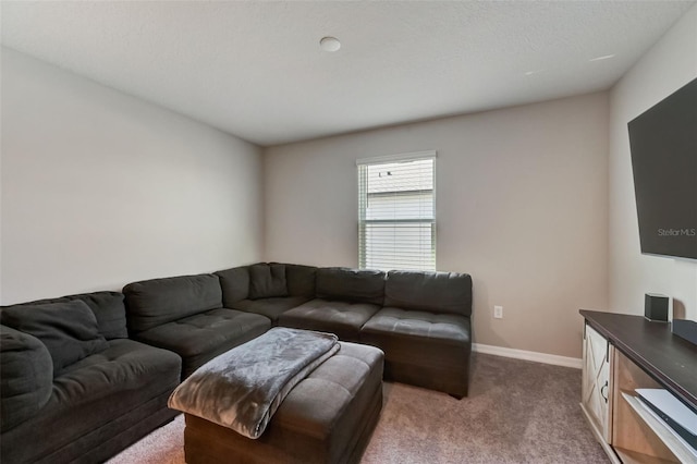 living area with baseboards and dark carpet