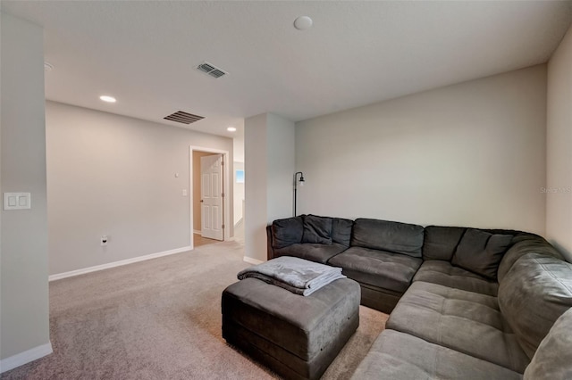 living area featuring baseboards, visible vents, recessed lighting, and light carpet