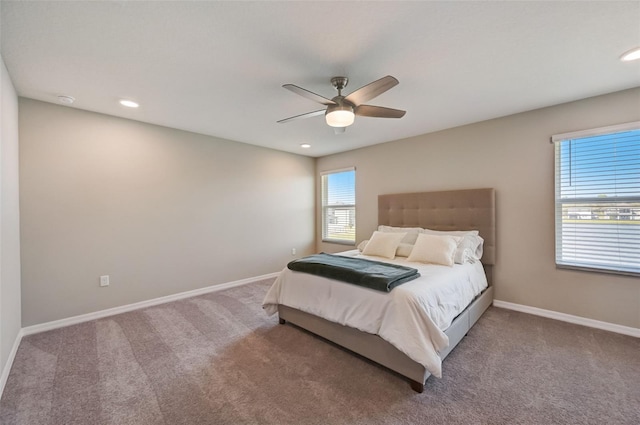 carpeted bedroom with a ceiling fan, baseboards, and recessed lighting