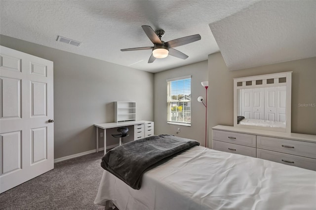 carpeted bedroom with a ceiling fan, a textured ceiling, baseboards, and visible vents