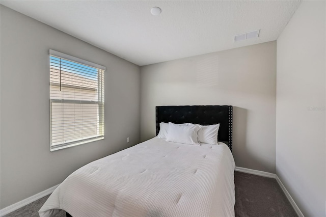 bedroom with carpet, baseboards, and visible vents