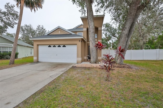 view of front of house featuring a front yard, fence, an attached garage, stucco siding, and concrete driveway