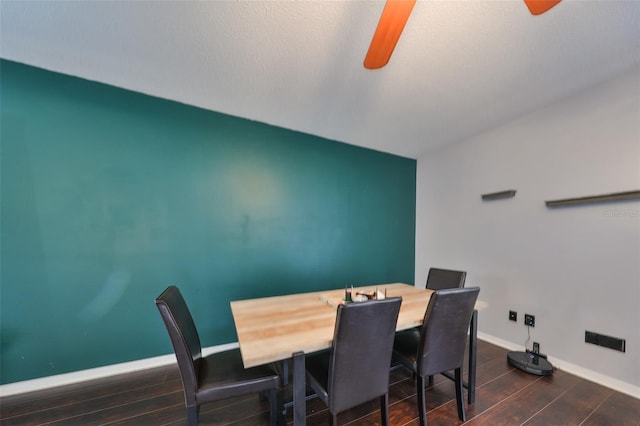 dining space featuring wood finished floors, baseboards, and ceiling fan