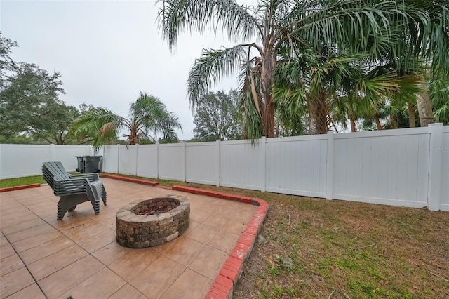 view of patio / terrace with an outdoor fire pit and a fenced backyard