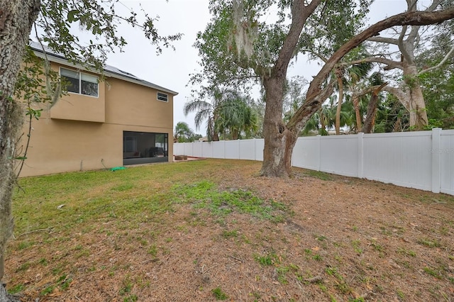 view of yard with a fenced backyard