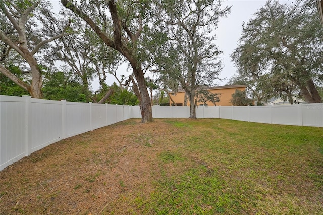 view of yard with a fenced backyard