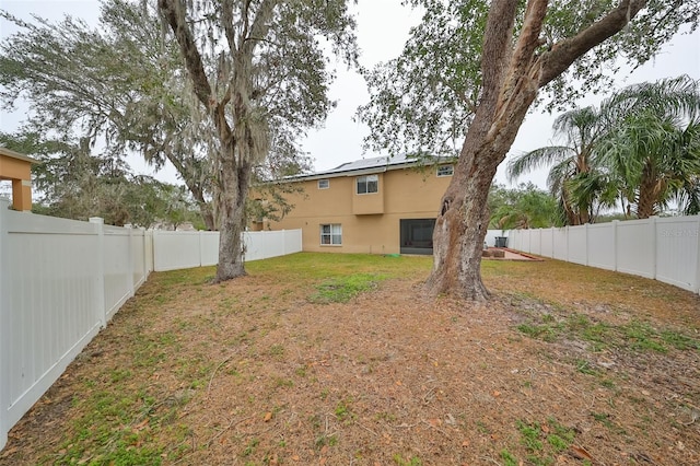 view of yard with a fenced backyard