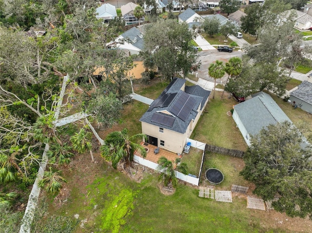 birds eye view of property with a residential view