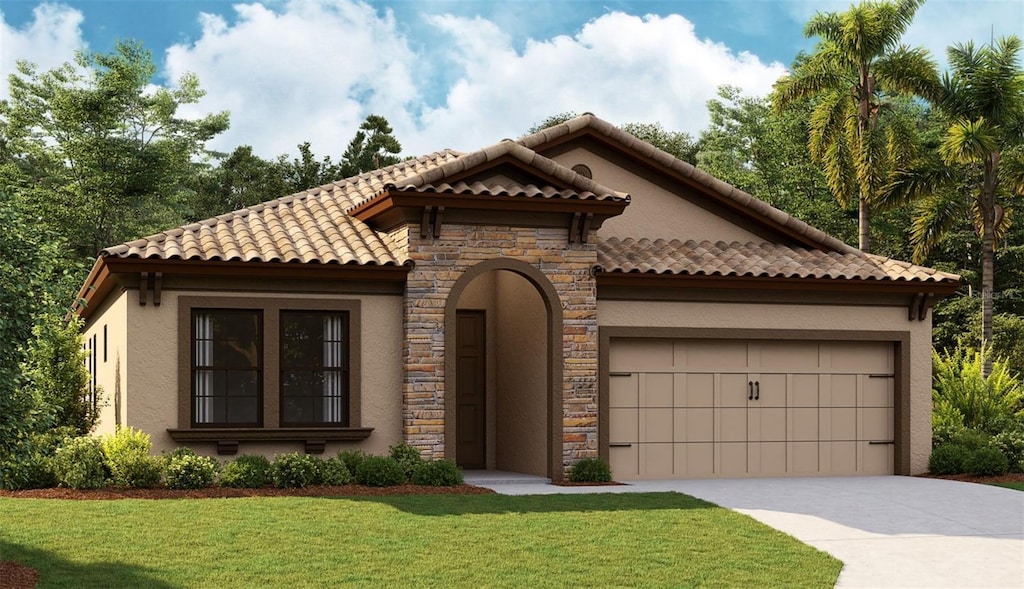 mediterranean / spanish-style house with stucco siding, a front lawn, stone siding, concrete driveway, and a garage