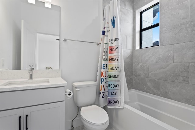 bathroom featuring toilet, vanity, and shower / bath combo