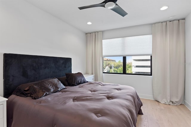 bedroom featuring recessed lighting, baseboards, ceiling fan, and light wood finished floors