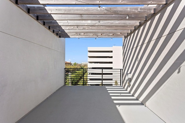 view of patio / terrace with a balcony and a pergola