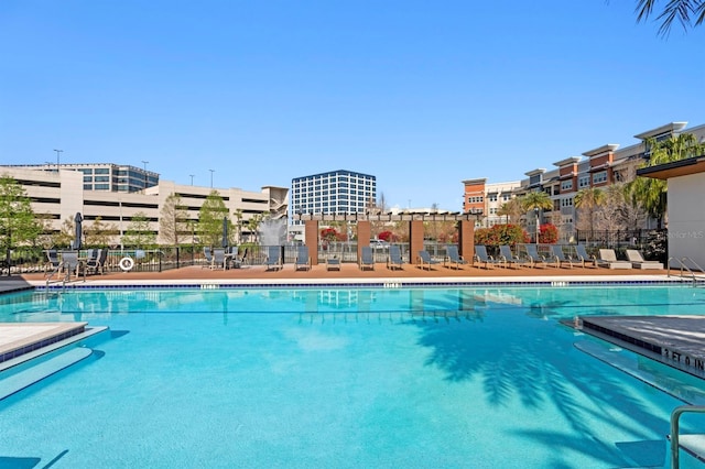 view of swimming pool with fence