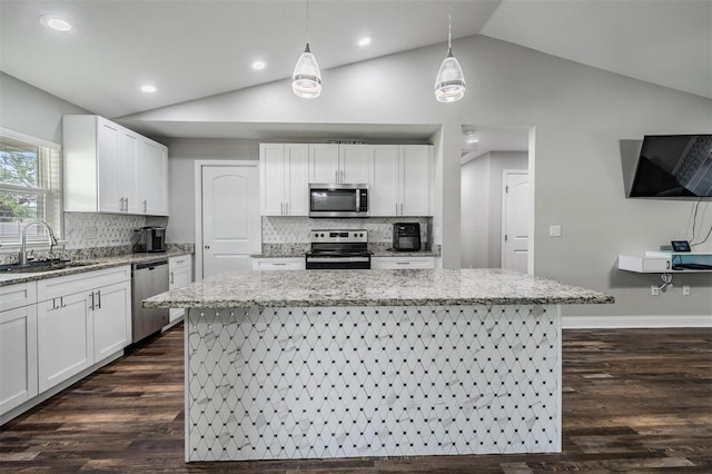 kitchen featuring a sink, lofted ceiling, dark wood finished floors, and stainless steel appliances