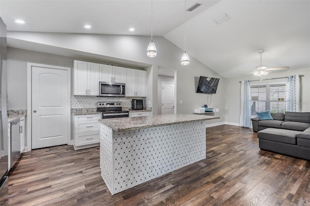 kitchen with dark wood-style floors, visible vents, white cabinets, appliances with stainless steel finishes, and open floor plan