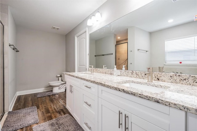 full bath featuring a shower stall, visible vents, and a sink