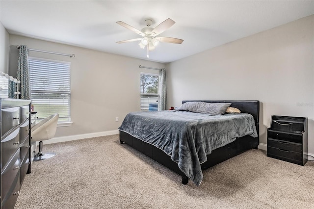 bedroom with carpet, baseboards, and ceiling fan