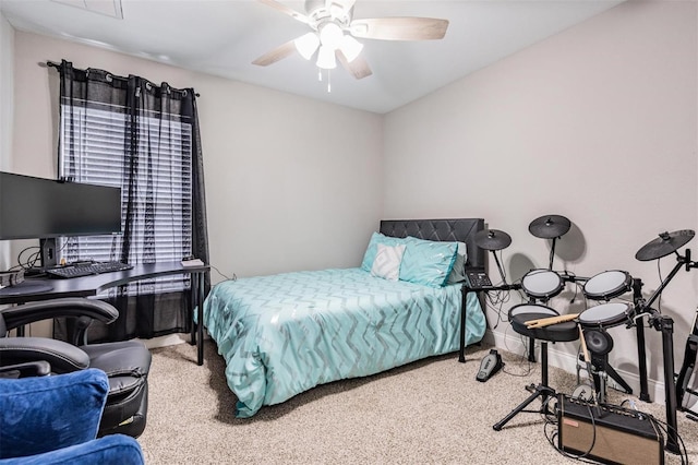 carpeted bedroom with baseboards and a ceiling fan