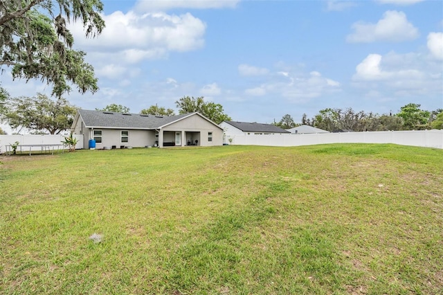 exterior space with a front yard and fence